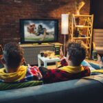 group-friends-watching-tv-sport-match-together-emotional-fans-cheering-favourite-team-watching-exciting-football-concept-friendship-leisure-activity-emotions_155003-38767